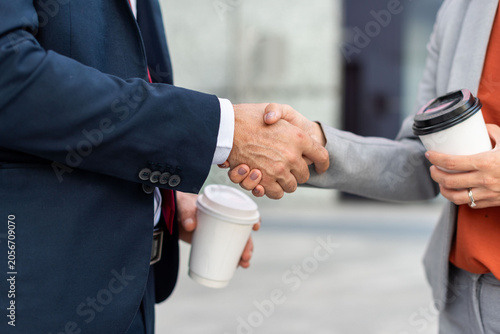 Konstfotografi Business handshake with coffee cups.