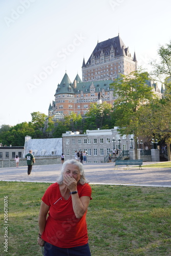 senior woman laughing in front of frontenac castle