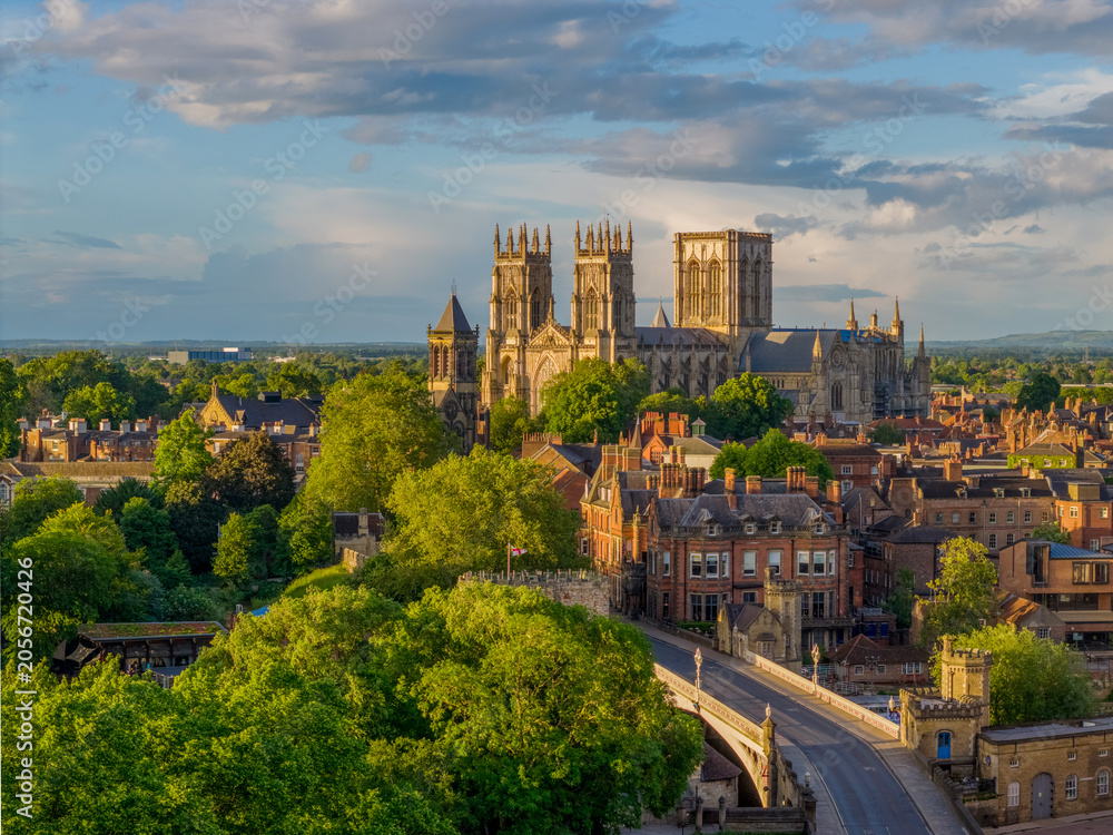 Fototapeta premium York city centre and York Minster in North Yorkshire, England, viewed across the historic skyline. Iconic church and medieval architecture in a popular UK tourism destination.