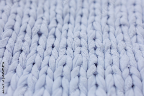 Photos Detailed close up of light blue chunky knit fabric texture