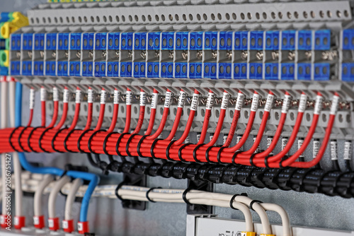 Marking electrical wiring wires with thermally printed nylon tape. 