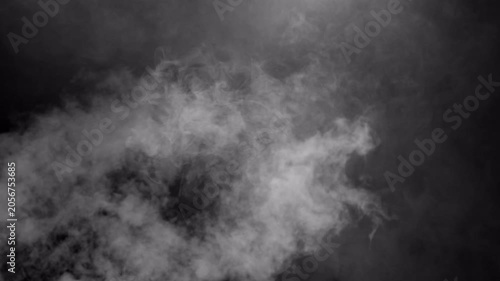 Dense white smoke billowing on a dark black background.