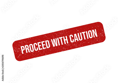 Red grunge rubber stamp with the text proceed with caution on it