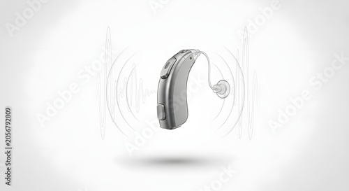 Modern digital hearing aid with sound wave visualization, medical audio device for hearing loss, silver electronic ear amplifier on white background