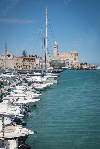 Boats from the old port and the panorama of the city of Trani; Province of Barletta–Andria–Trani, Puglia, Italy