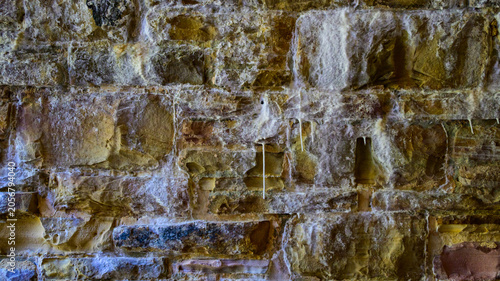 Historic Byrd Creek Dam located at Cumberland Mountain State Park in Crossville, Tennessee. A stone wall of an old bridge constructed