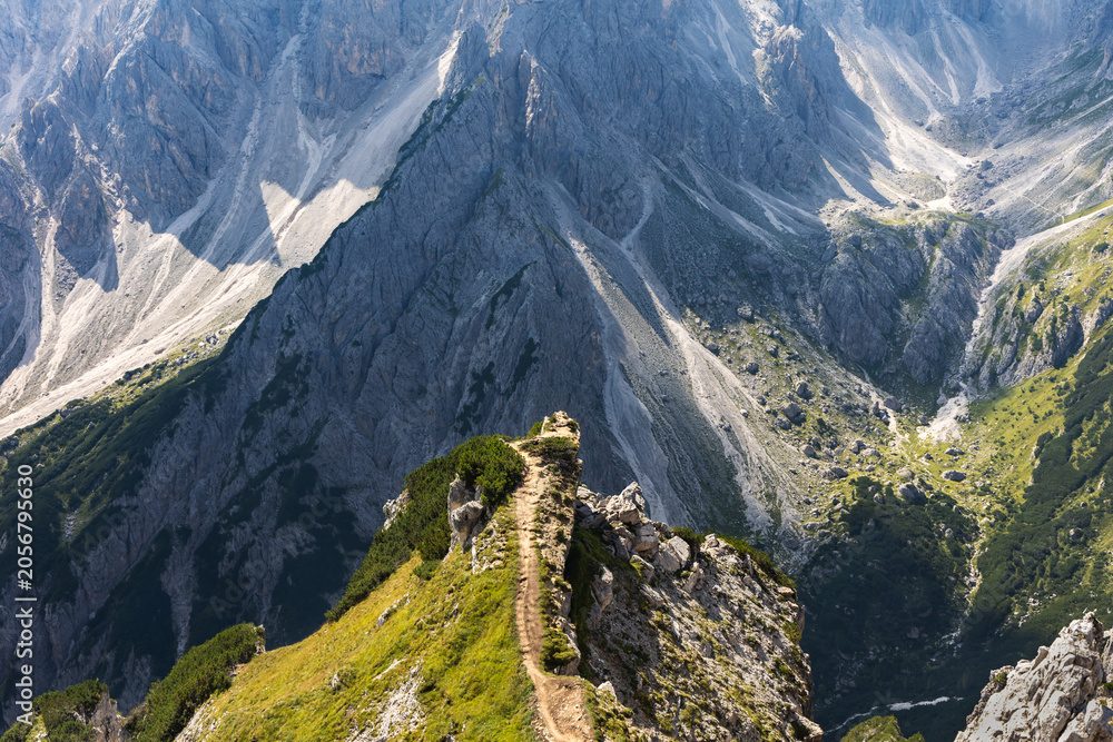 Fototapeta premium South Tyrol, Italy - August 30. 2024: The steep path to the famous viewpoint of Cadini di Misurina mountain range in the Tre Cime region, Dolomites, Italy