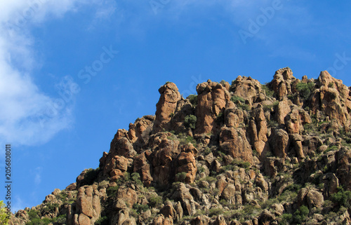 Rocky volcanic formations of Cáncarix under blue sky in Albacete, Spain.