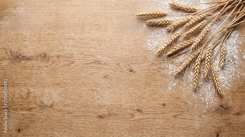 Flour and Wheat Ears on Wood with Bakery Copy Space