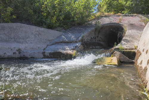 Large round sewage outlet contributing to coastal pollution