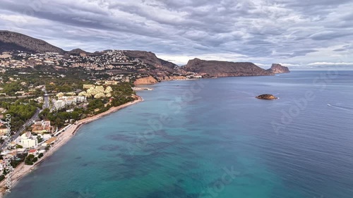 Turquoise Bay With Offshore Rock View, Clear Water Over Reefs, Shallow Seabed Patches, Coastal Town At Shore,