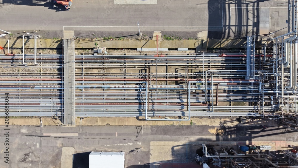 Naklejka premium Industrial pipelines at crude oil refinery aerial view