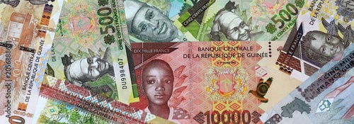 Bilde på lerret Guinean franc money banknotes bunch on table