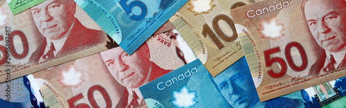 Photography Canadian dollar money bills in pile on table