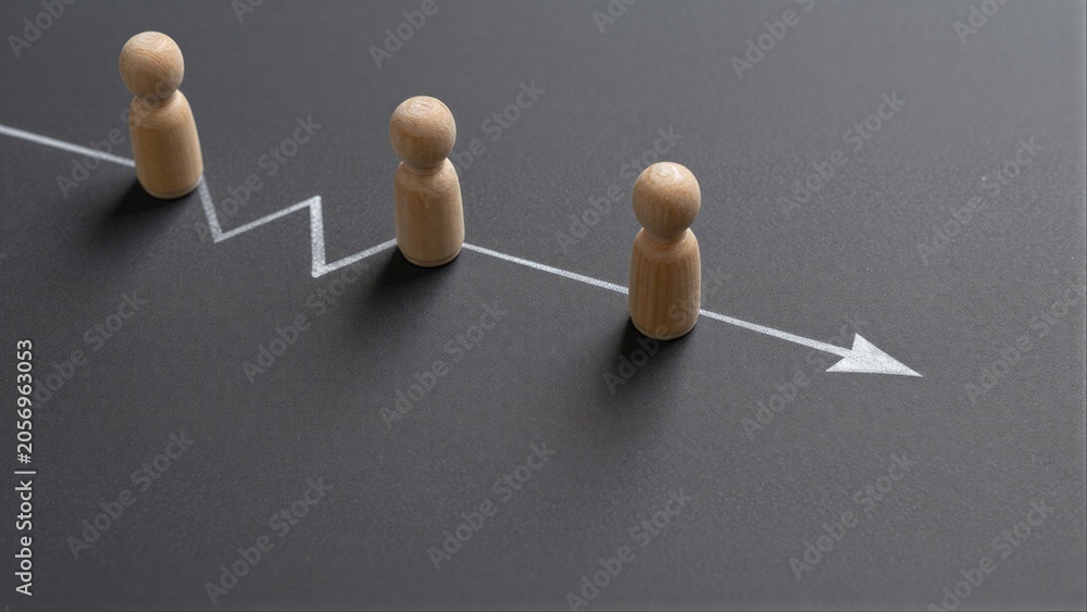 Obraz premium Wooden figures follow a rising arrow, symbolizing growth and progress.