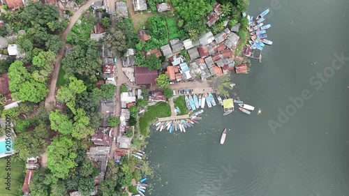 Top Down Drone Descending Shot Over Lakeside Village Near Cirata Reservoir Indonesia