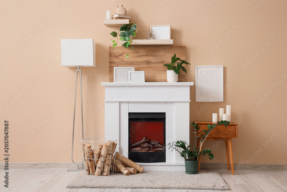 Obraz premium Modern living room interior with white fireplace, decorative shelves, and cozy home decor elements