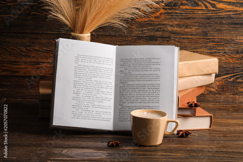 Cup of hot coffee with book...