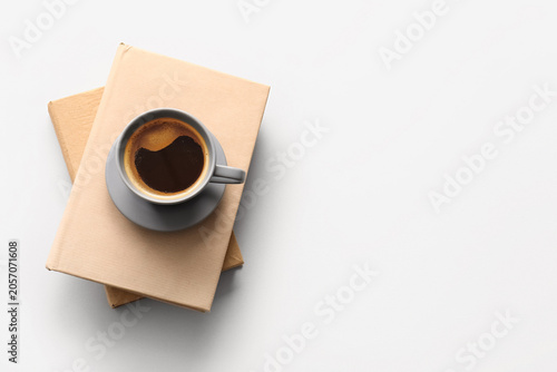 Cup of hot coffee with book...