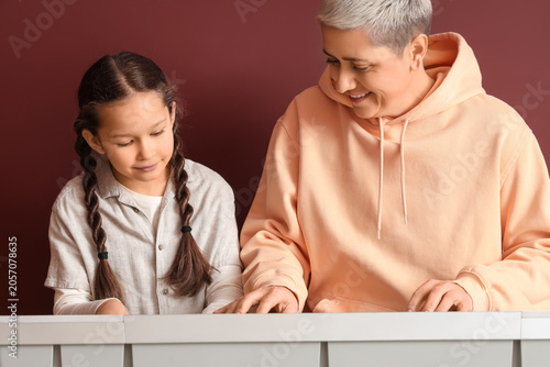 Female music teacher giving...