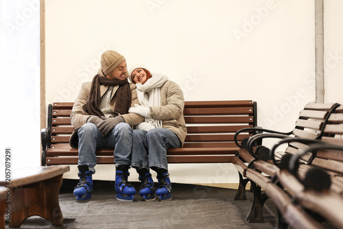 Happy young couple in ice s...