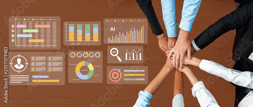 Tableau sur toile Diverse business professionals gather in an office setting, collaborating over data visuals and analysis tools to enhance performance and strategize for success