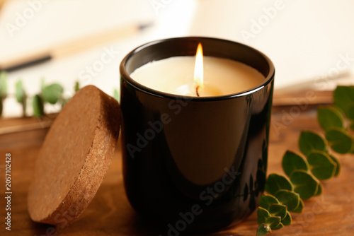 Wooden tray, burning candle...