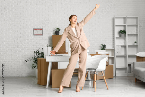 Excited young businesswoman...