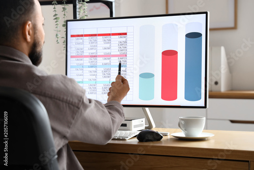 Male data scientist working...