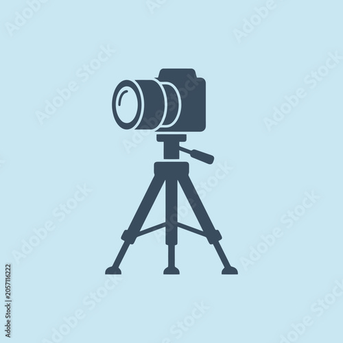 A professional camera mounted on a sturdy tripod stand