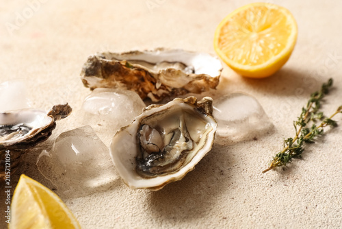 Fresh raw oysters on ice wi...