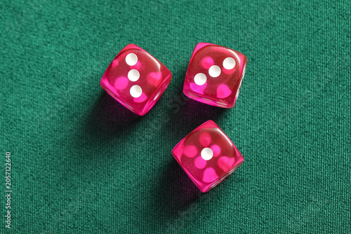 Three pink translucent dice...