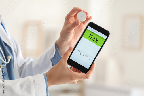 Female doctor with mobile p...