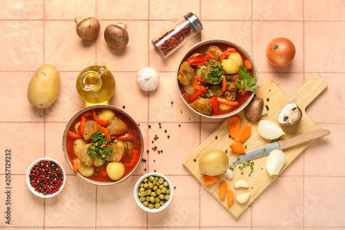 Εκτύπωση καμβά Hearty beef stew with potatoes, carrots, and bell peppers in bowls, overhead vie
