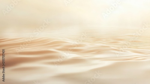 Gentle golden waves create soft ripples on a calm lake surface with diffused light