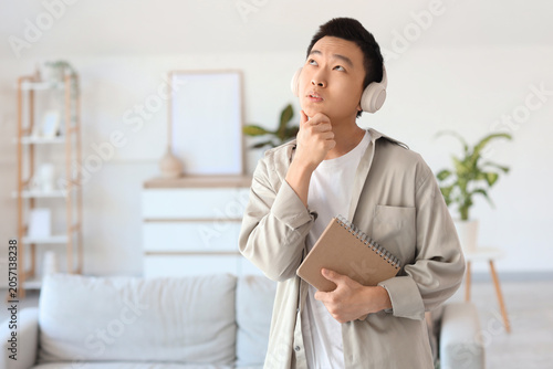 Thoughtful young Asian man ...