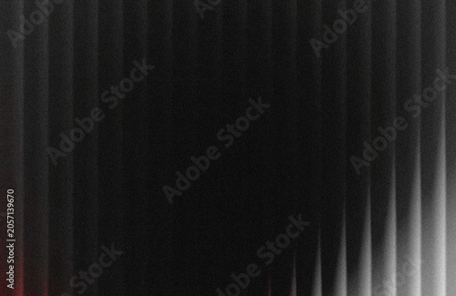 Dark vertical blinds on window with sunlight