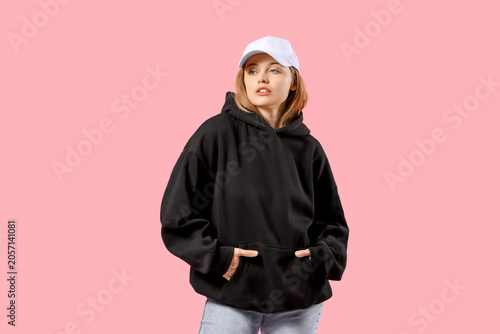 Young woman in black hoodie...