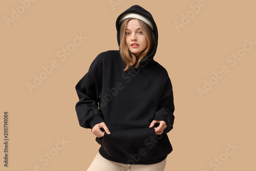 Young woman in black hoodie...
