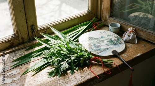 Dragon Boat Festival herbs and decorations on windowsill