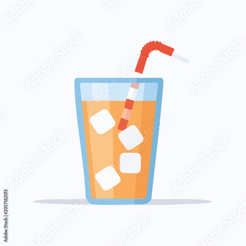 Refreshing glass of orange juice with ice cubes and straw