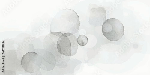 Foto Abstract watercolor spheres in muted gray tones float gently against a soft, ethereal white background, creating a serene and minimalist composition