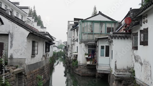 Narrow Canal Between Traditional Waterside Houses