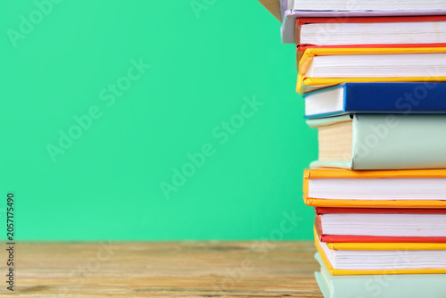 Stack of colorful books on ...