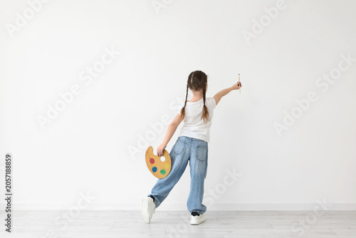 Young girl with paint palet...