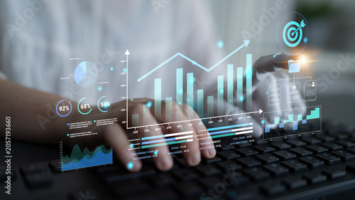 Obraz na płótnie Business analytics and data visualization concept with graphs, charts, and digital interface above a keyboard in a modern workspace environment Haptic