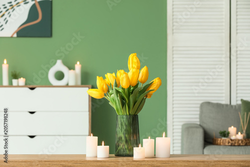 Burning candles and tulip f...