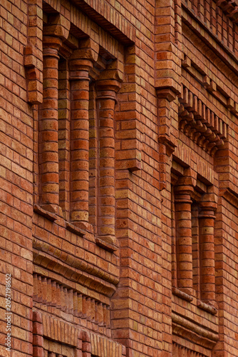 Slika na platnu Detailed brickwork pattern with pilasters and corbels on historic wall