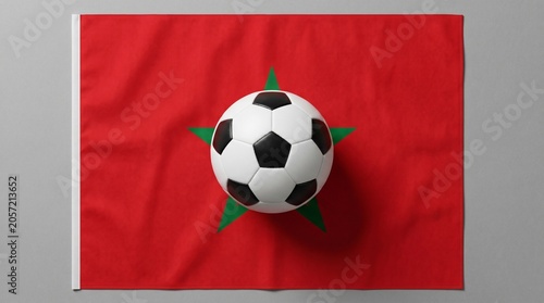 Football on the Morocco national flag over grey background