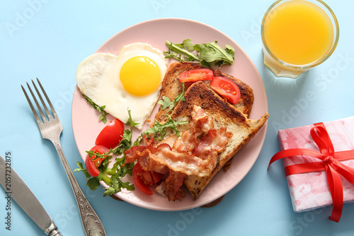 Plate with tasty fried egg,...